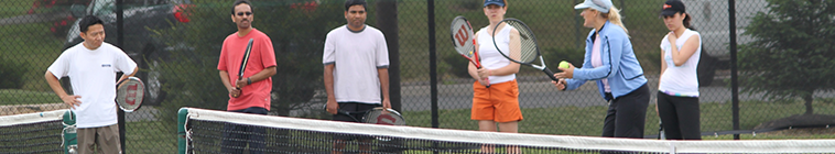 adults playing tennis