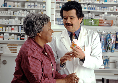 Woman and pharmacist interacting