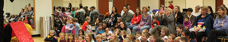 children watch puppet show